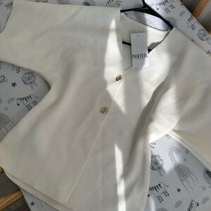 Elegant white V Neck assymetrical Cotton top